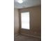 Small bedroom with window and closet at 435 Victoria Blvd, Oxford, GA 30054