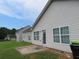 House exterior with backyard and patio at 435 Victoria Blvd, Oxford, GA 30054