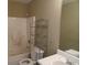 Bathroom with shower/tub, toilet and shelving at 435 Victoria Blvd, Oxford, GA 30054