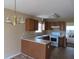 Kitchen with wood cabinets and a breakfast bar at 435 Victoria Blvd, Oxford, GA 30054