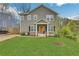 Two story house with orange door and green lawn at 1944 Lakewood Se Ter, Atlanta, GA 30315