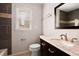 Updated bathroom with granite countertop and dark tile at 2990 Mountain Ne Trce, Roswell, GA 30075