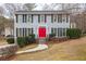 Two-story house with gray siding and red front door at 2990 Mountain Ne Trce, Roswell, GA 30075