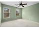Well-lit bedroom with light green walls and ceiling fan at 2990 Mountain Ne Trce, Roswell, GA 30075