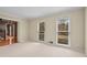 Bright living room with neutral walls and carpet flooring at 2990 Mountain Ne Trce, Roswell, GA 30075