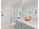 Double vanity bathroom with shower and a window at 77 Werner Brook Way, Atlanta, GA 30354