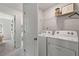 Convenient laundry room with washer, dryer, and storage shelf at 77 Werner Brook Way, Atlanta, GA 30354