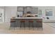 Open concept kitchen with gray cabinets and large island at 77 Werner Brook Way, Atlanta, GA 30354