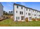 View of townhouses from the backyard, showing multiple units at 77 Werner Brook Way, Atlanta, GA 30354