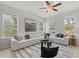 Bright living room features a large sectional sofa and ample natural light at 77 Werner Brook Way, Atlanta, GA 30354