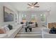 Spacious living room with sectional sofa and large windows at 77 Werner Brook Way, Atlanta, GA 30354