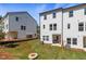 Two townhouses share a fenced backyard with patio, fire pit and grassy area at 77 Werner Brook Way, Atlanta, GA 30354