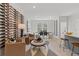 Living room with wine wall, seating area, and dining area at 77 Werner Brook Way, Atlanta, GA 30354