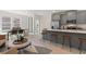 Open concept kitchen with island, gray cabinets, and stainless steel appliances at 77 Werner Brook Way, Atlanta, GA 30354