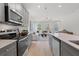 Gray kitchen cabinets, quartz countertops, and stainless steel appliances at 77 Werner Brook Way, Atlanta, GA 30354