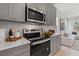 Modern kitchen with gray cabinets and quartz countertops at 77 Werner Brook Way, Atlanta, GA 30354