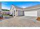 Gray siding townhouse with attached garage and driveway at 753 Camry Cir, Dallas, GA 30157