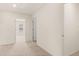 Bright hallway with carpet and doors leading to bedrooms at 305 Silver Moon Dr, Loganville, GA 30052