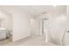 Upstairs hallway with carpet and access to bedrooms at 305 Silver Moon Dr, Loganville, GA 30052