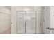 Large walk-in shower with glass enclosure and built-in shelving at 305 Silver Moon Dr, Loganville, GA 30052