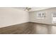 Bright living room with hardwood floors and ceiling fan at 305 Silver Moon Dr, Loganville, GA 30052