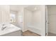Bathroom boasts double vanity, tile flooring and a bathtub at 305 Silver Moon Dr, Loganville, GA 30052