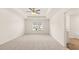 Spacious main bedroom with plush carpeting and large window at 305 Silver Moon Dr, Loganville, GA 30052