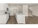 Modern kitchen with white cabinets and quartz countertops at 305 Silver Moon Dr, Loganville, GA 30052