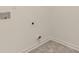 Laundry room with tile flooring and hookups for washer/dryer at 305 Silver Moon Dr, Loganville, GA 30052