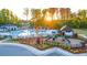 Community pool, playground, and clubhouse nestled in a wooded area at 305 Silver Moon Dr, Loganville, GA 30052
