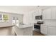 Open concept kitchen with stainless steel appliances at 305 Silver Moon Dr, Loganville, GA 30052