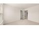 Spacious bedroom with carpet, closet, and access to hallway at 305 Silver Moon Dr, Loganville, GA 30052