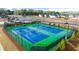 Two well-lit tennis courts in a residential community at 305 Silver Moon Dr, Loganville, GA 30052