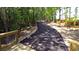 Paved nature trail winding through lush woods at 305 Silver Moon Dr, Loganville, GA 30052