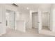 Upstairs hallway with carpet and multiple closets at 305 Silver Moon Dr, Loganville, GA 30052