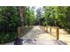 Scenic nature trail with wooden bridge, perfect for walking or biking at 305 Silver Moon Dr, Loganville, GA 30052
