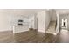 Open concept kitchen with island and hardwood floors at 305 Silver Moon Dr, Loganville, GA 30052