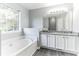 Double vanity bathroom with granite countertop and soaking tub at 5452 Sweetsprings, Powder Springs, GA 30127