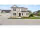 Two-story brick home with attached two-car garage and landscaped front yard at 570 Silver Moon Dr, Loganville, GA 30052