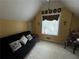 Versatile bonus room with a futon, window, and neutral color palette at 2606 Ramblewood Ct, Acworth, GA 30102