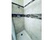 Clean shower with tile surround and neutral tones at 2606 Ramblewood Ct, Acworth, GA 30102