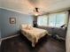 Cozy bedroom with light walls and floral bedding at 2606 Ramblewood Ct, Acworth, GA 30102