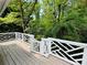 Wooden deck with white railing offering a view of the backyard at 2606 Ramblewood Ct, Acworth, GA 30102