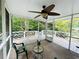 Screened porch with ceiling fan, and access to deck overlooking wooded area at 2606 Ramblewood Ct, Acworth, GA 30102