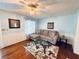 Bright living room featuring hardwood floors and comfy seating at 2606 Ramblewood Ct, Acworth, GA 30102
