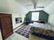 Spacious bedroom with a queen bed, built-in shelving, and ceiling fan at 2606 Ramblewood Ct, Acworth, GA 30102
