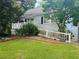 Charming ranch home with deck and mature trees at 2606 Ramblewood Ct, Acworth, GA 30102
