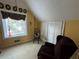 Bright bonus room with a comfy armchair, window, and built-in storage at 2606 Ramblewood Ct, Acworth, GA 30102