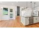 Modern kitchen with white cabinets, large island, and stainless steel appliances at 2899 Treeside Terrace, Marietta, GA 30066