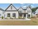 Two story white brick home with gray roof and shutters at 2899 Treeside Terrace, Marietta, GA 30066